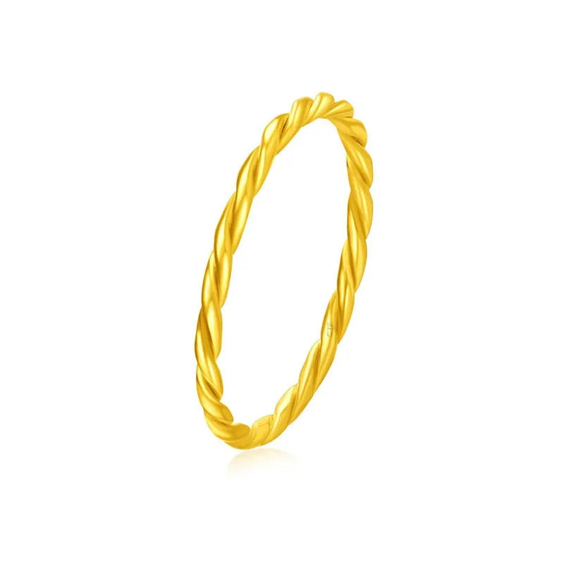 Simple bracelet brass gold plated ring in glossy finish on white background