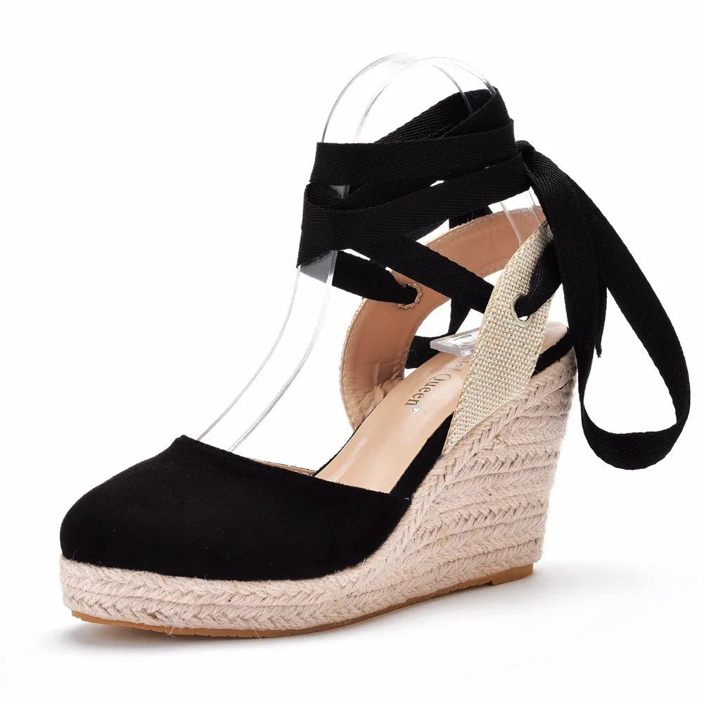 Women's apricot bohemian wedge sandals with beaded tassels, a buckle fastening, and a high wedge heel on a raised platform.