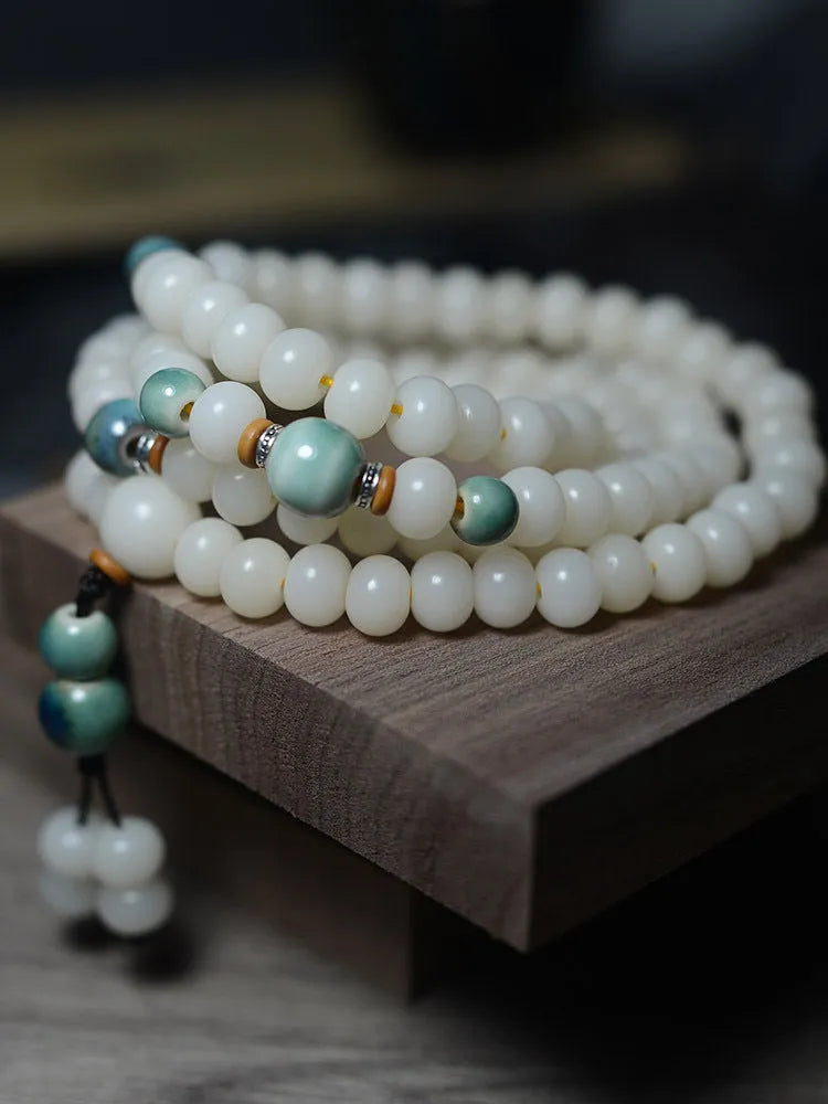 White Jade Bodhi Root Oblate Bead Bracelet with 108 natural bodhi seeds beads in 7x9mm and 8x10mm sizes