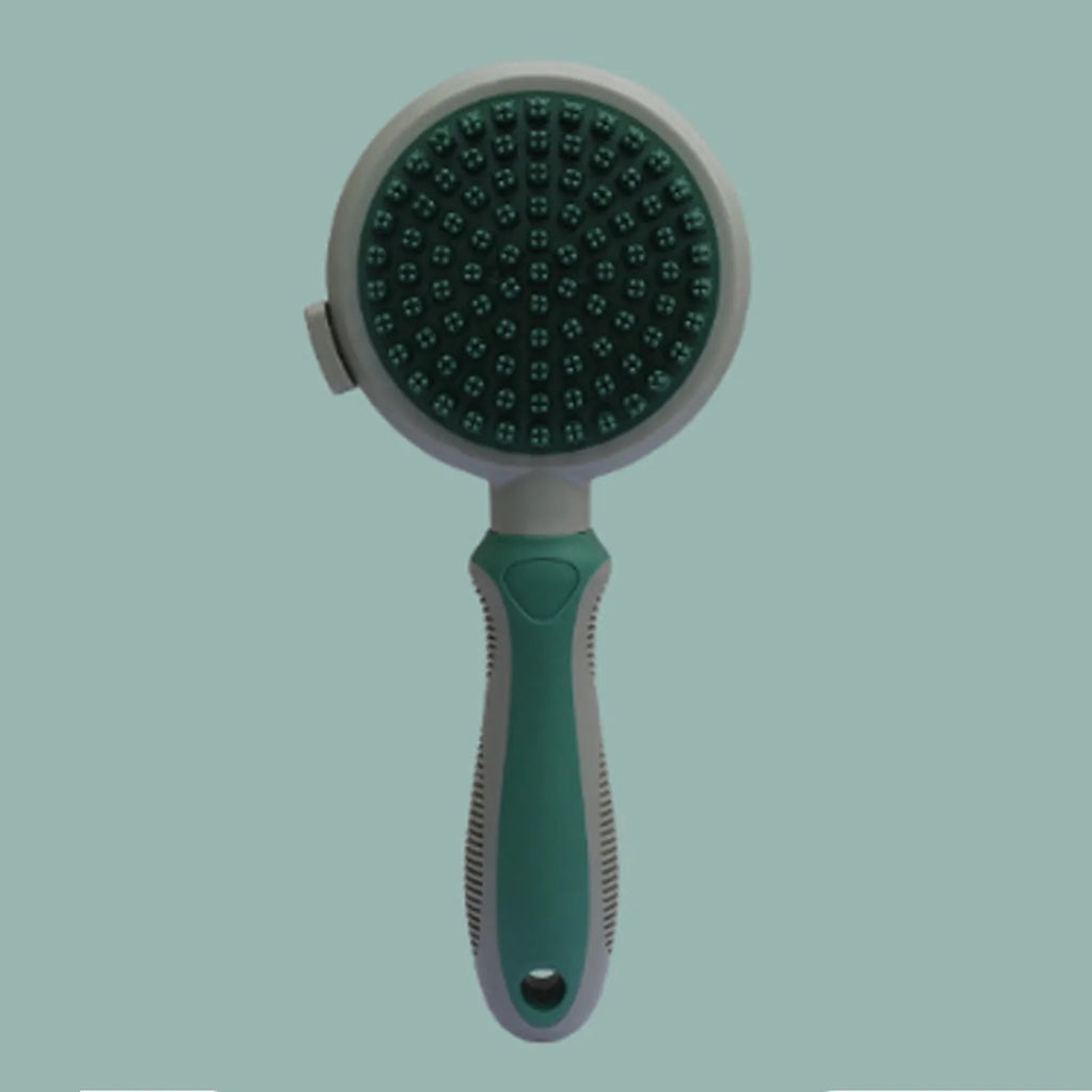 Pink and green dual-sided cat grooming brush with flea comb and release button