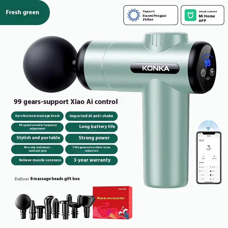 Konka V19 grey professional mini massage gun with multiple massage heads on a table.