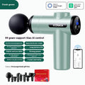 Konka V19 grey professional mini massage gun with multiple massage heads on a table.