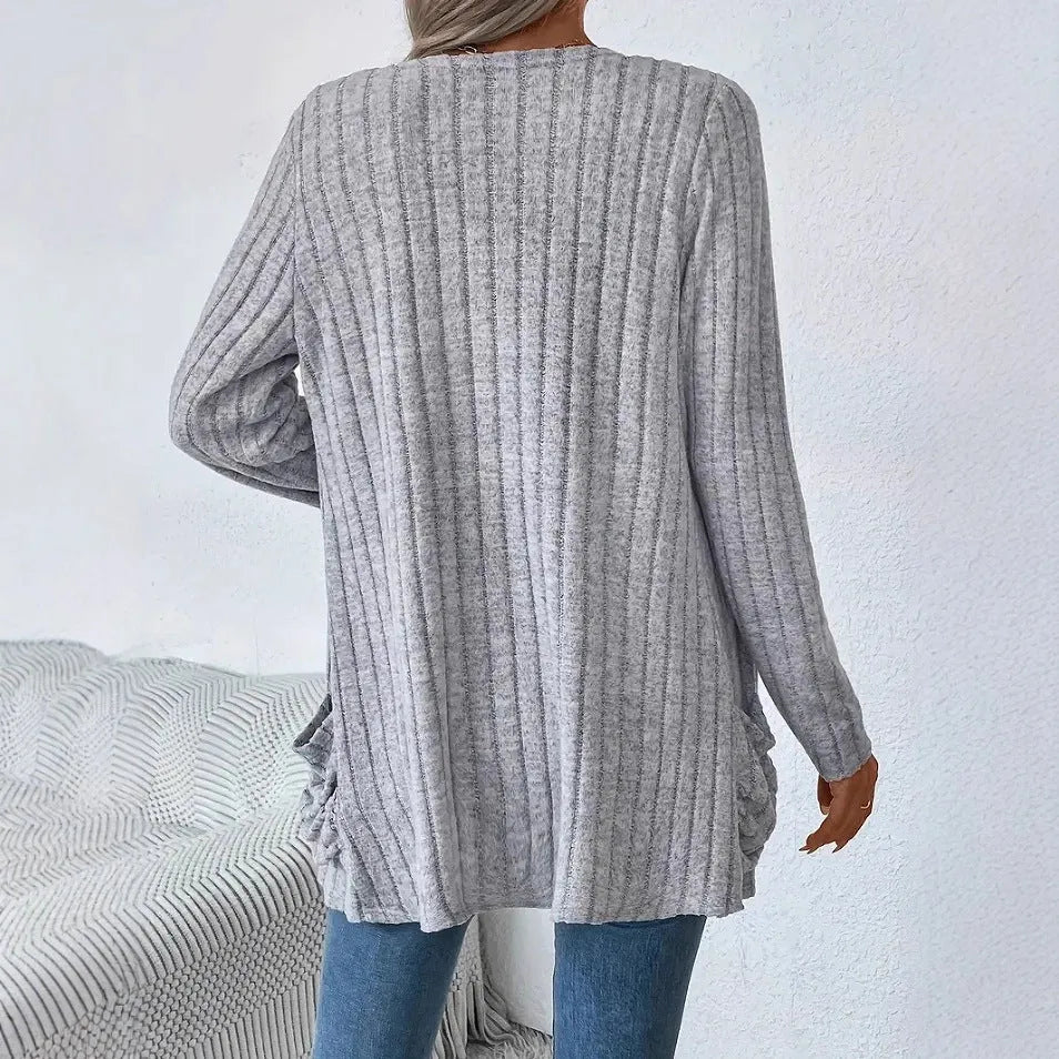 Solid colour long sleeve cardigan with front pockets, loose fit polyester knitwear