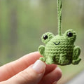 Green handmade plush woven frog car pendant hanging, showing its 15cm length and cartoon style.