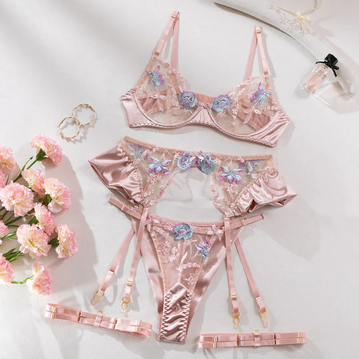 Light purple satin lingerie four-piece set with mercerized embroidery on a white background