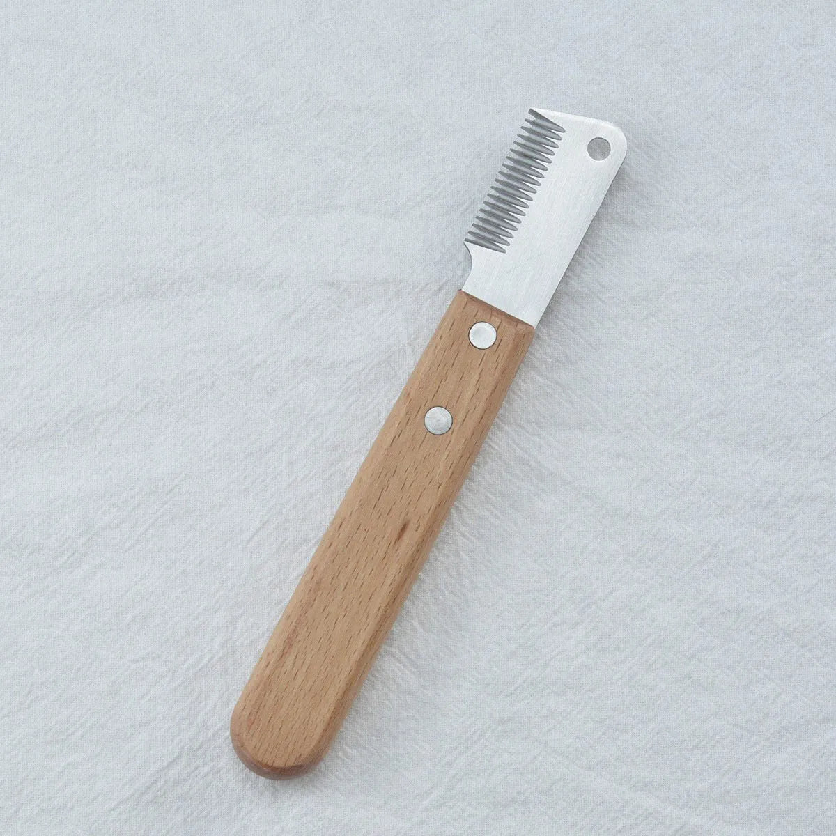 Pet stripping comb with metal blade and wooden handle for grooming dogs and cats