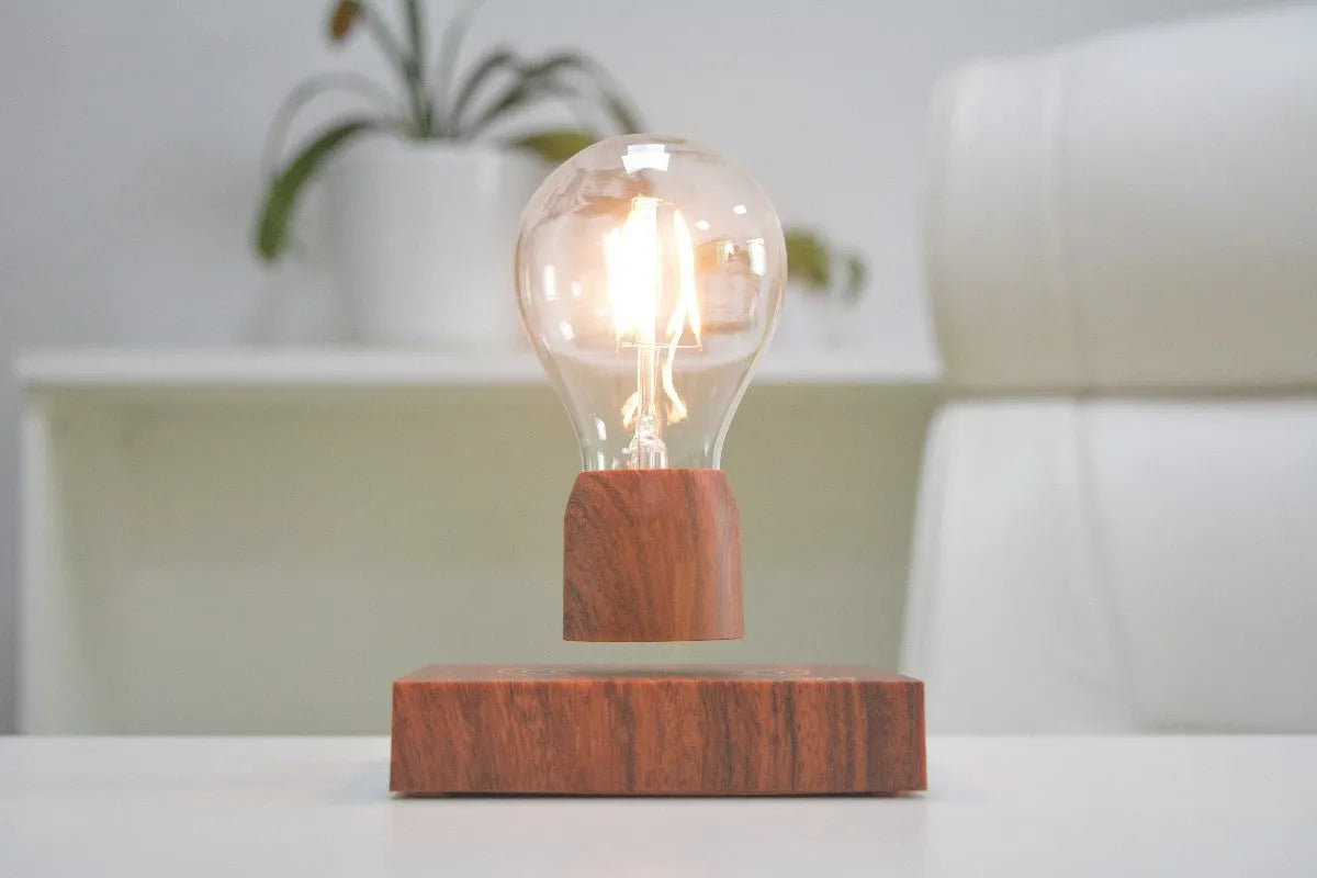 Magnetic levitation floating bulb lamp with ABS glass construction on imitation wood base