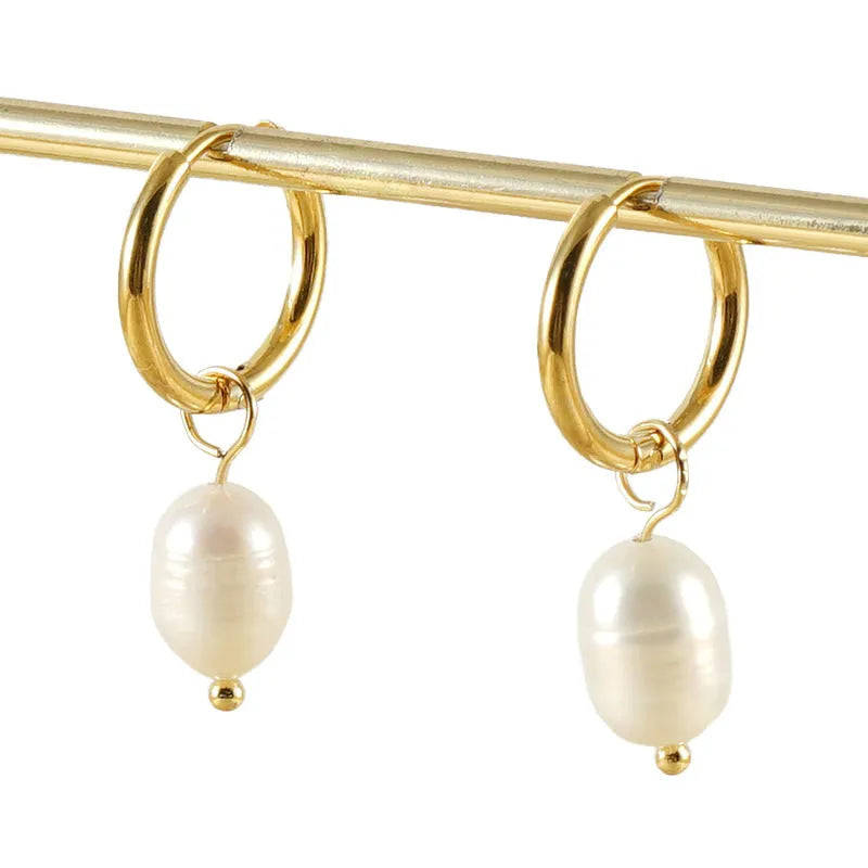 Gold-coloured geometric drop earrings with pearl accents on stainless steel for women