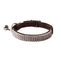 Pink cat collar with elastic buckle and D-ring, made from soft flocking fabric.