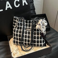 Woolen shoulder bag in black with horizontal square shape and sandwich pocket for commuting and shopping use