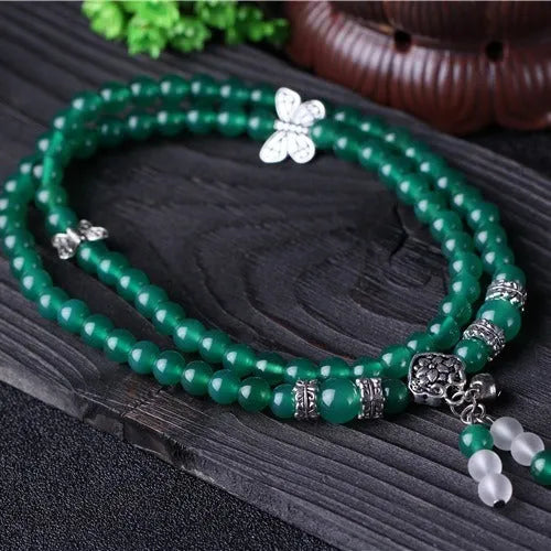 Natural green agate chain multi-layer bracelet with 6mm beads on a woman's wrist