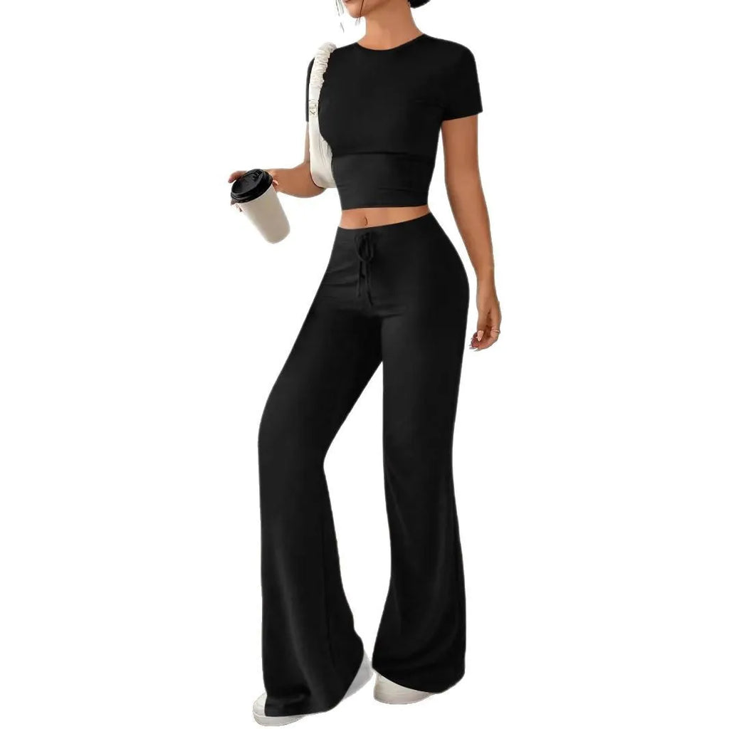 Black high waist trousers and short sleeve t-shirt co-ord set on hanger