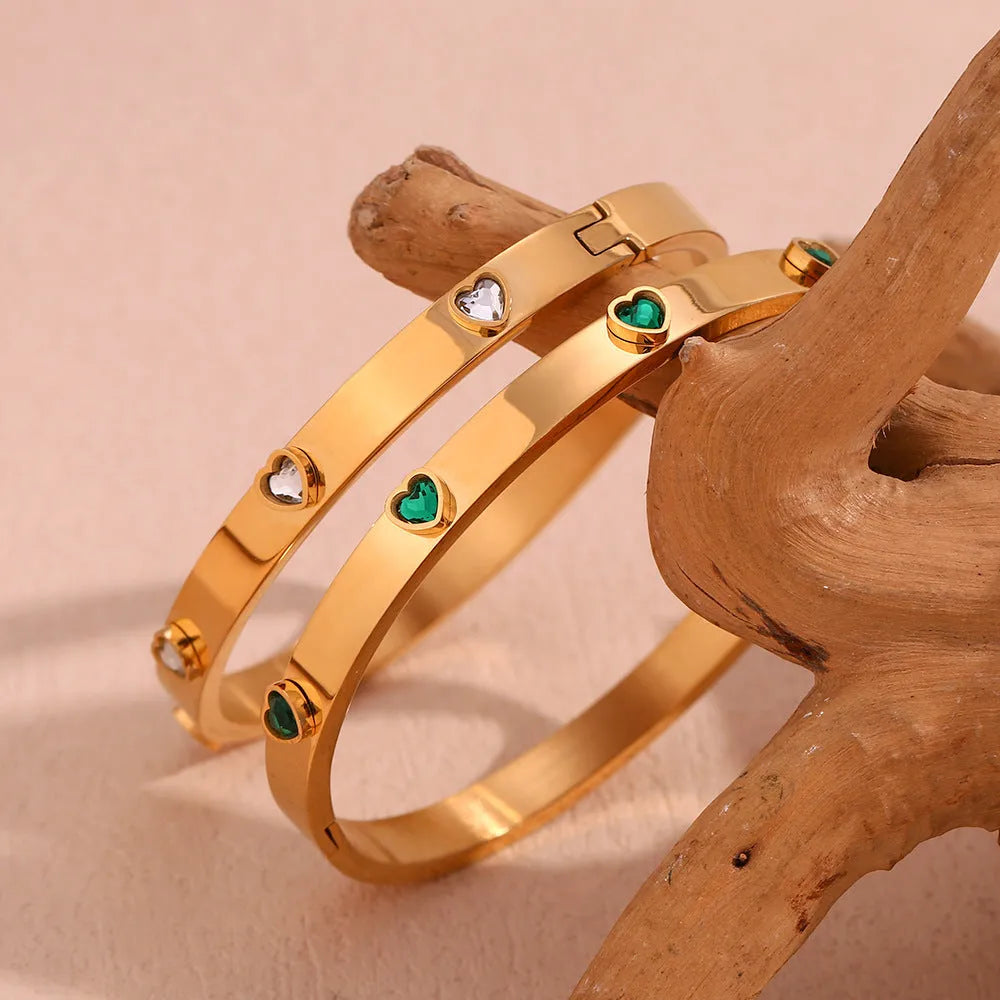 Stainless steel bracelet with peach heart centrepiece and micro-inlaid detailing in golden finish