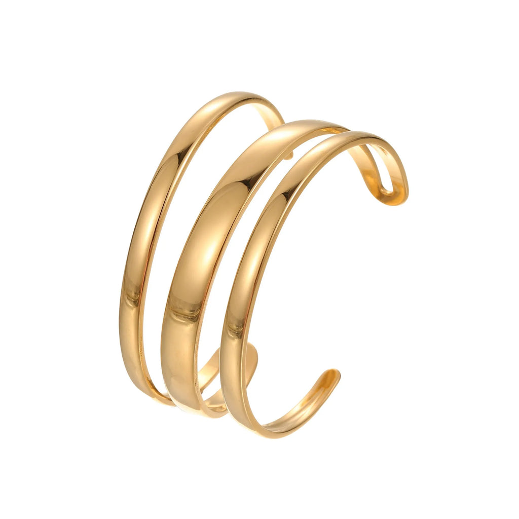 A simple open geometric stainless steel bracelet for women, shown in a gold tone finish.