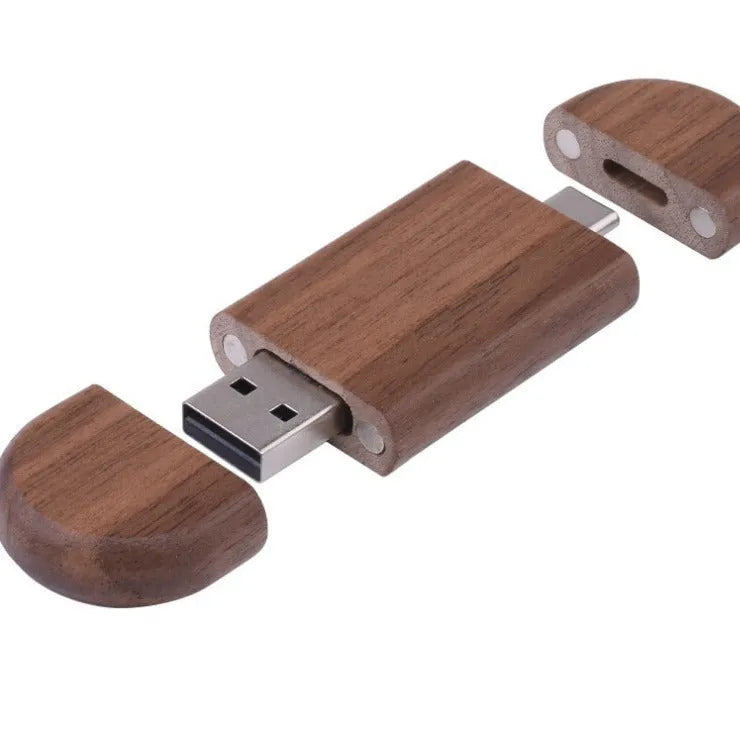 Maple wooden USB flash drive with Type-C connector on a wooden surface.