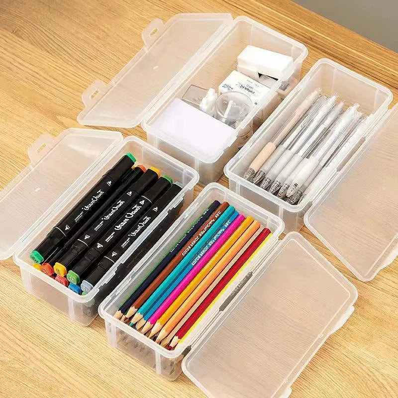 Transparent plastic stationery storage box showing pencils and art supplies inside