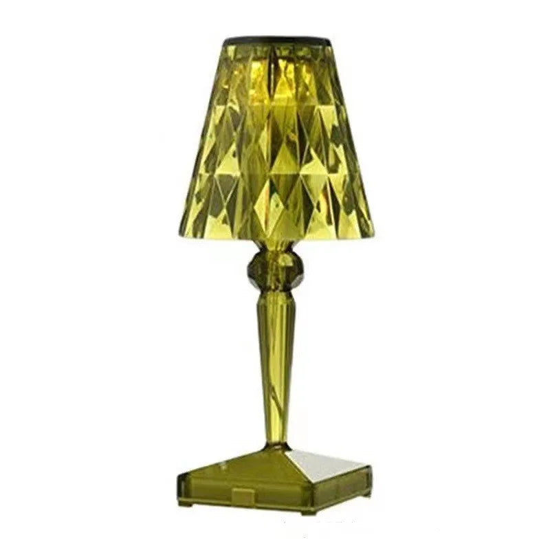 Portable rose gold touch control night light with acrylic lamp holder on a table.