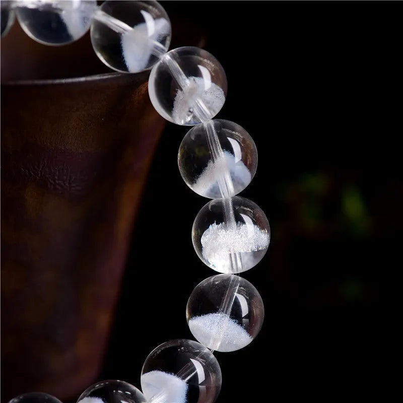 Natural white crystal ghost pyramid bracelet with Ruyi elements showing pyramid shapes and original design