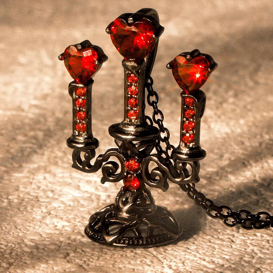 Close-up of a women's zinc alloy Gothic necklace with a hollow retro candlestick pendant on a cross chain.