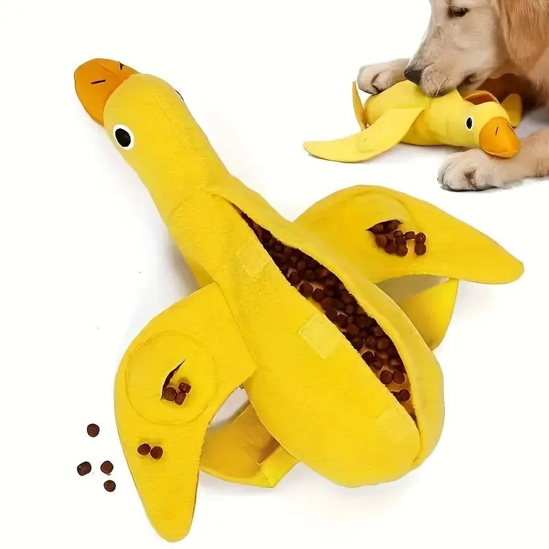 Yellow plush teddy duck dog training toy with squeaker and treat dispensing compartment.
