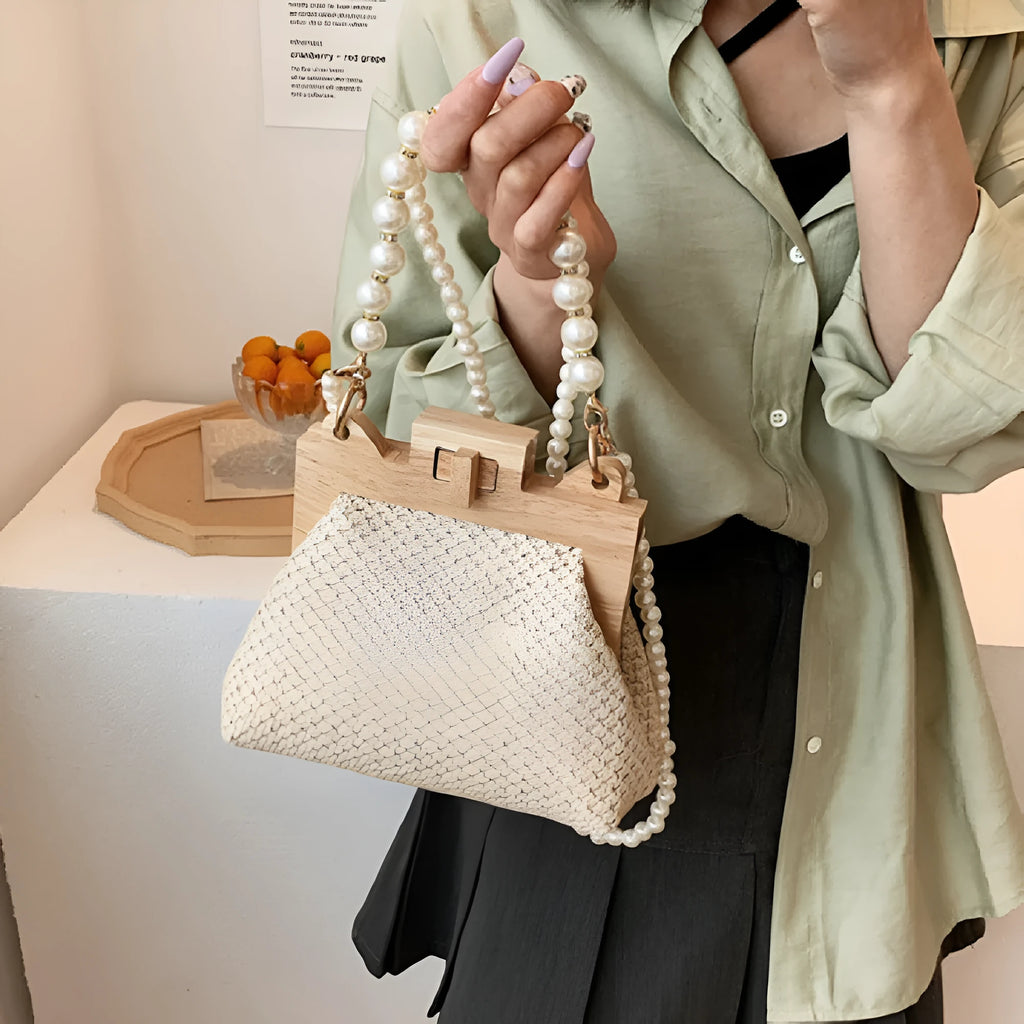 Women's straw woven shoulder bag with beach pearl chain detailing and horizontal square shape