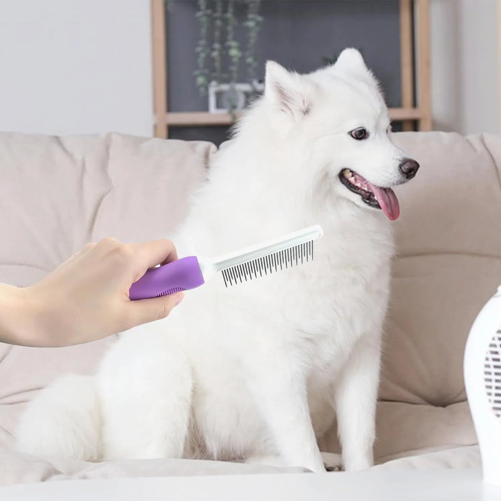 Purple handled pet grooming comb with stainless steel teeth for detangling dog and cat hair.