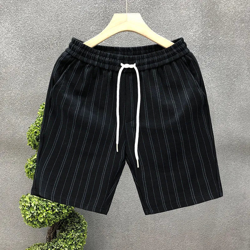 Men's black and white striped fleece-lined casual shorts with a double-layer waistband.