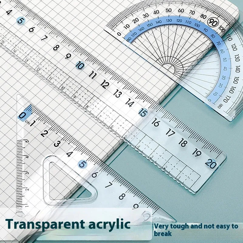 Transparent acrylic geometry ruler set with protractor, square, triangle, and ruler on a drawing