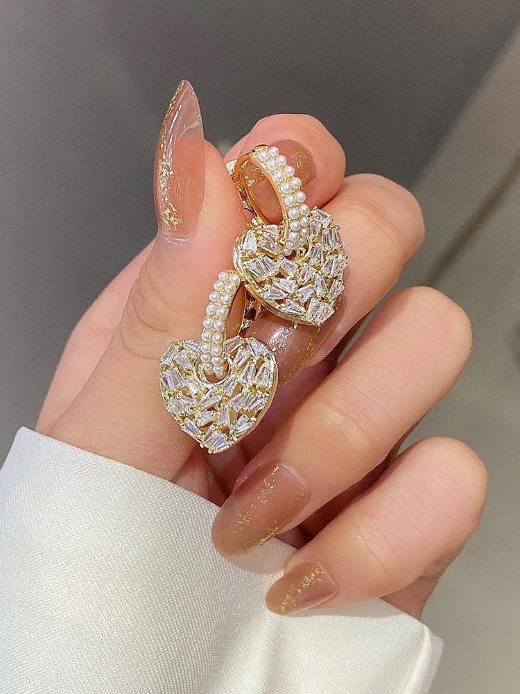 Heart shaped copper earrings with yellow finish and zircon stone for women