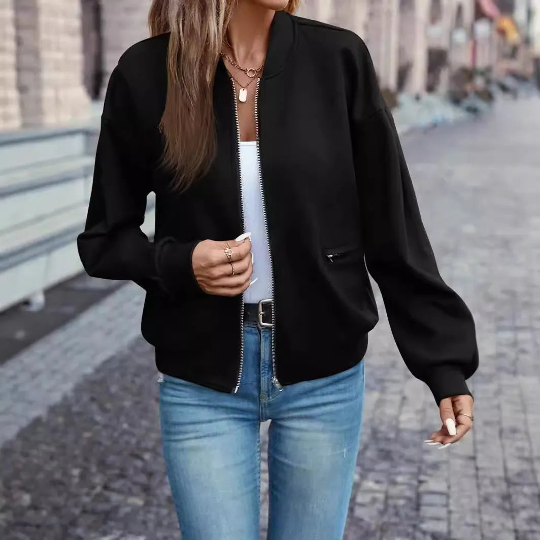 Black women's casual long sleeve zip jacket with faux pocket detailing on a model