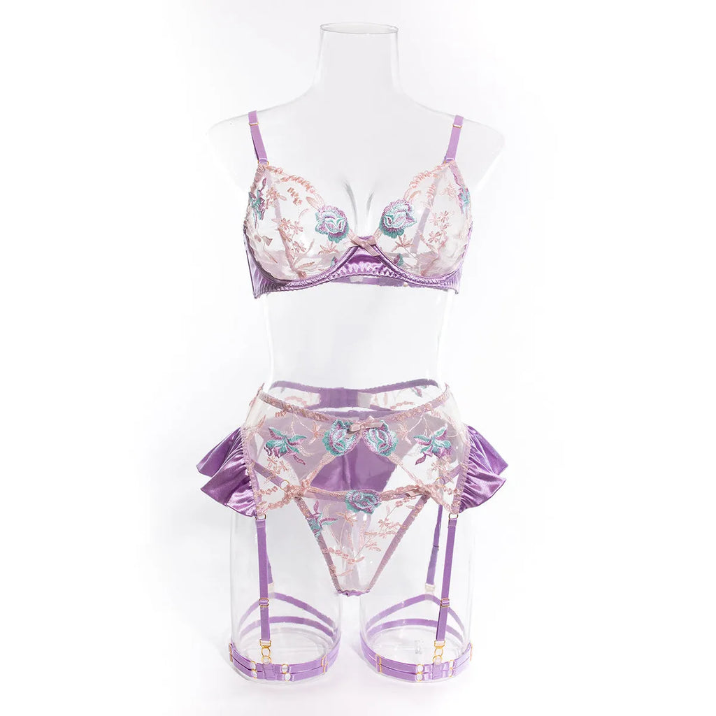 Light purple satin lingerie four-piece set with mercerized embroidery on a white background