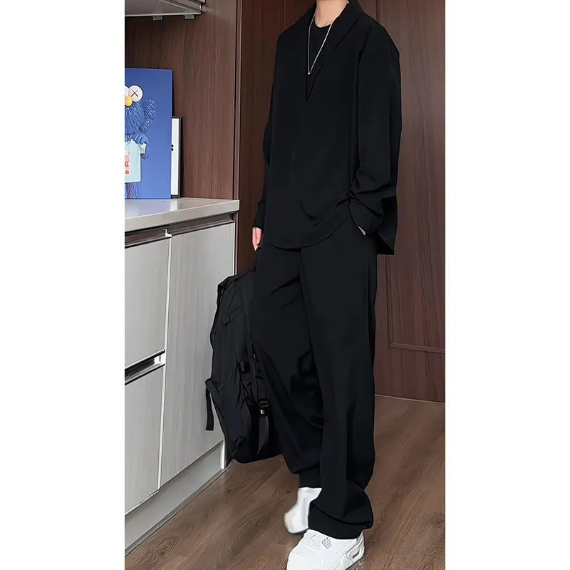 Men's black casual two-piece suit with long sleeve polo shirt and matching trousers