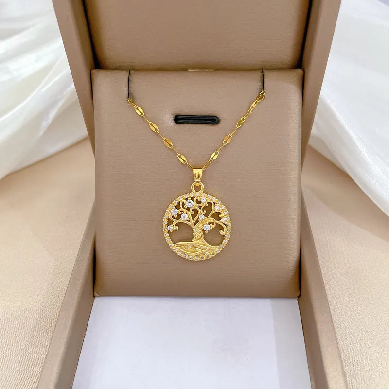Gold-plated necklace with a detailed rhinestone lucky tree pendant on a Mother Pearl base.