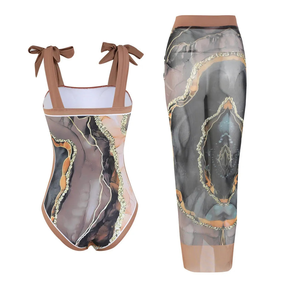 Floral print one-piece polyester swimsuit with matching skirt, sleeveless, available in brown printing