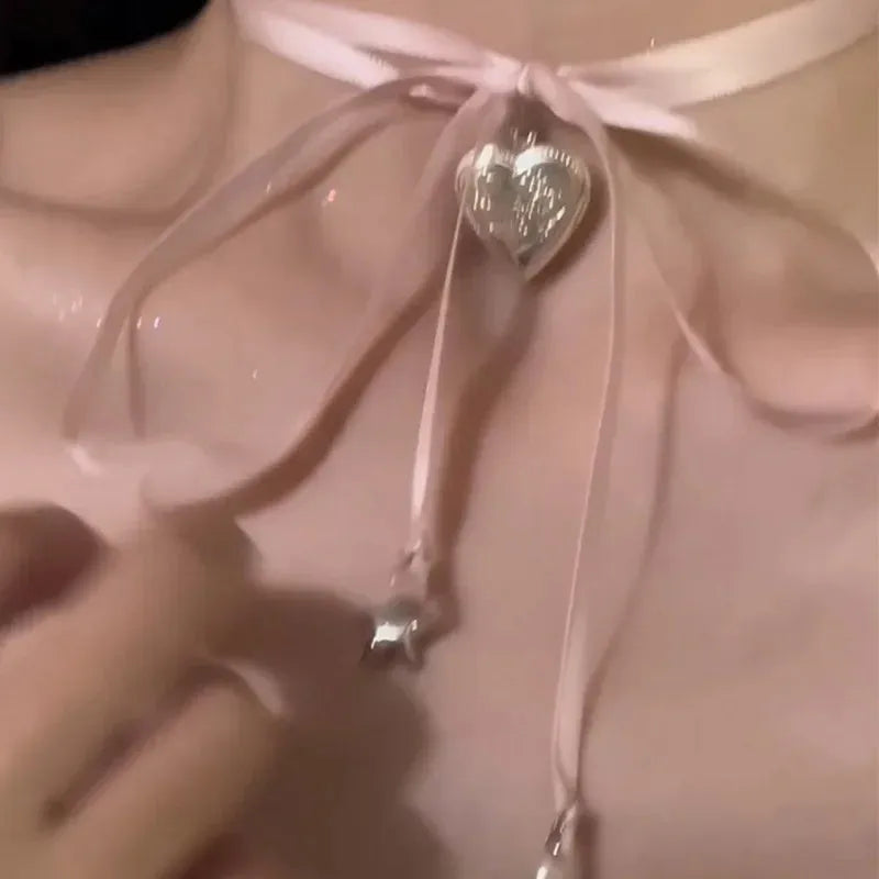 Women's electroplated alloy necklace with love pendant featuring ribbon design on clavicle chain