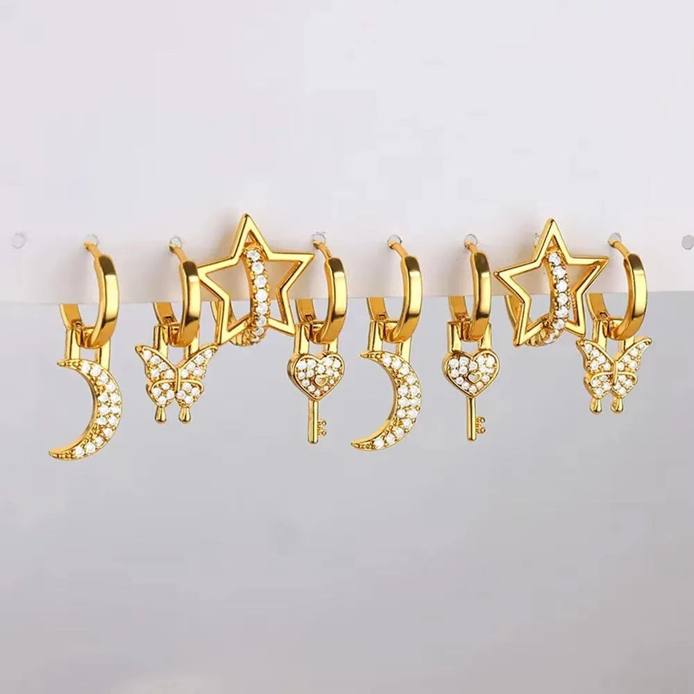Geometric butterfly-shaped copper earrings for women with heart and star design details.