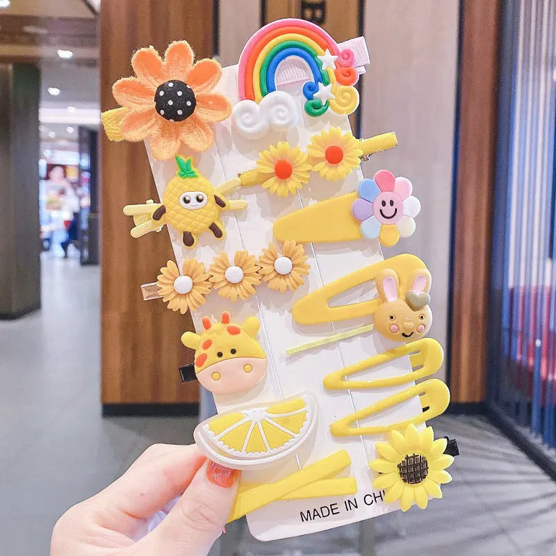14-piece toddler hair accessories set: colourful rainbow, fruit, and butterfly barrettes in soft silicone clay.