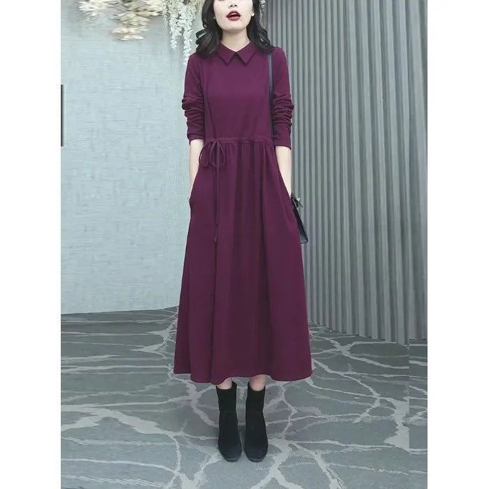 Purplish red plus size women's dress with extra long sleeves and a long skirt for autumn and winter office wear.