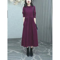 Purplish red plus size women's dress with extra long sleeves and a long skirt for autumn and winter office wear.