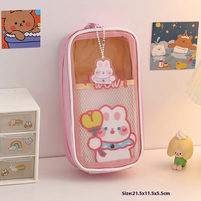 Transparent PVC pencil case with cartoon bear design showing pens inside