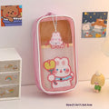 Transparent PVC pencil case with cartoon bear design showing pens inside