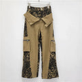 Dark khaki leopard print high-waist women's jeans with straight leg and retro tooling style details.