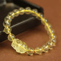 Yellow leather bracelet with a Pi Xiu charm and artificial crystal beads in national style.