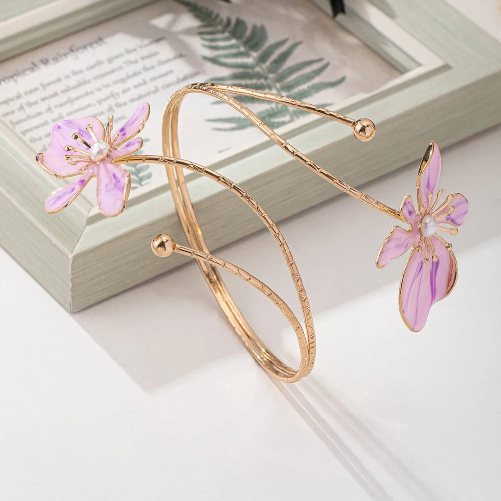 Alloy hollow armband bracelet with decorative pattern in pink or purple colour