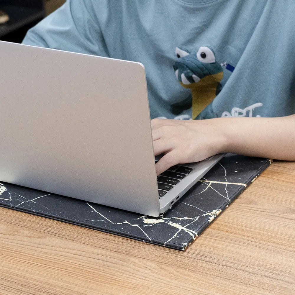 Anti-radiation tablet pad in multiple colours on a desk next to a tablet