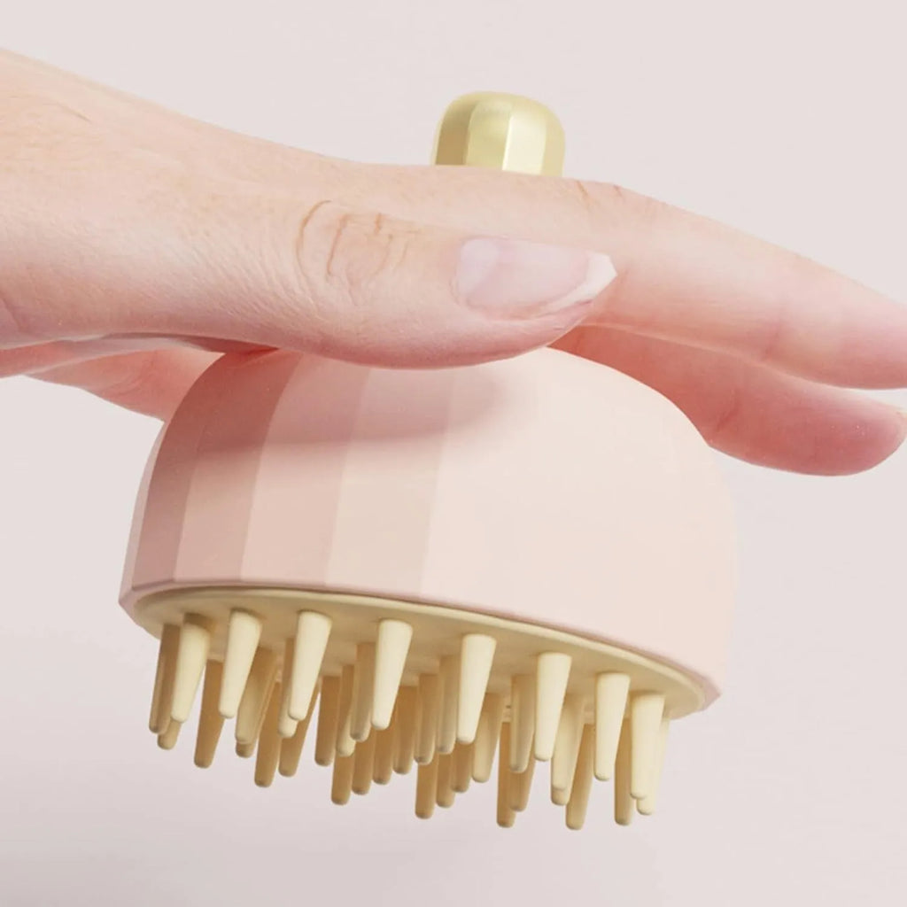 Green pet bath massage brush with silicone bristles and drain holes on a white background.