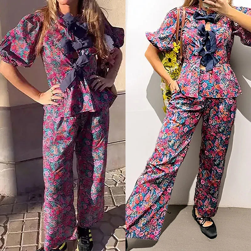 Floral printed women's trouser suit with puff sleeve top and tie-neck
