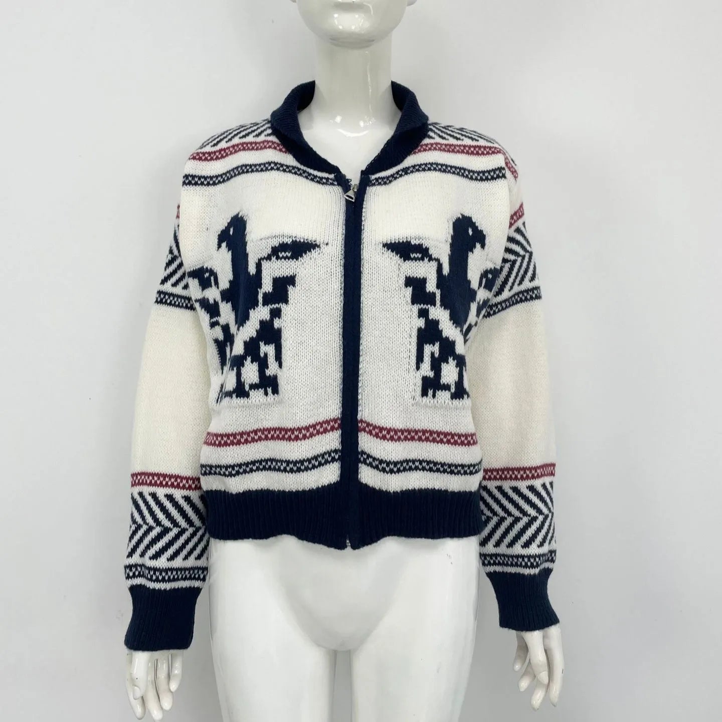 White women's wool zip cardigan with a jacquard contrast colour pattern on the lapel.