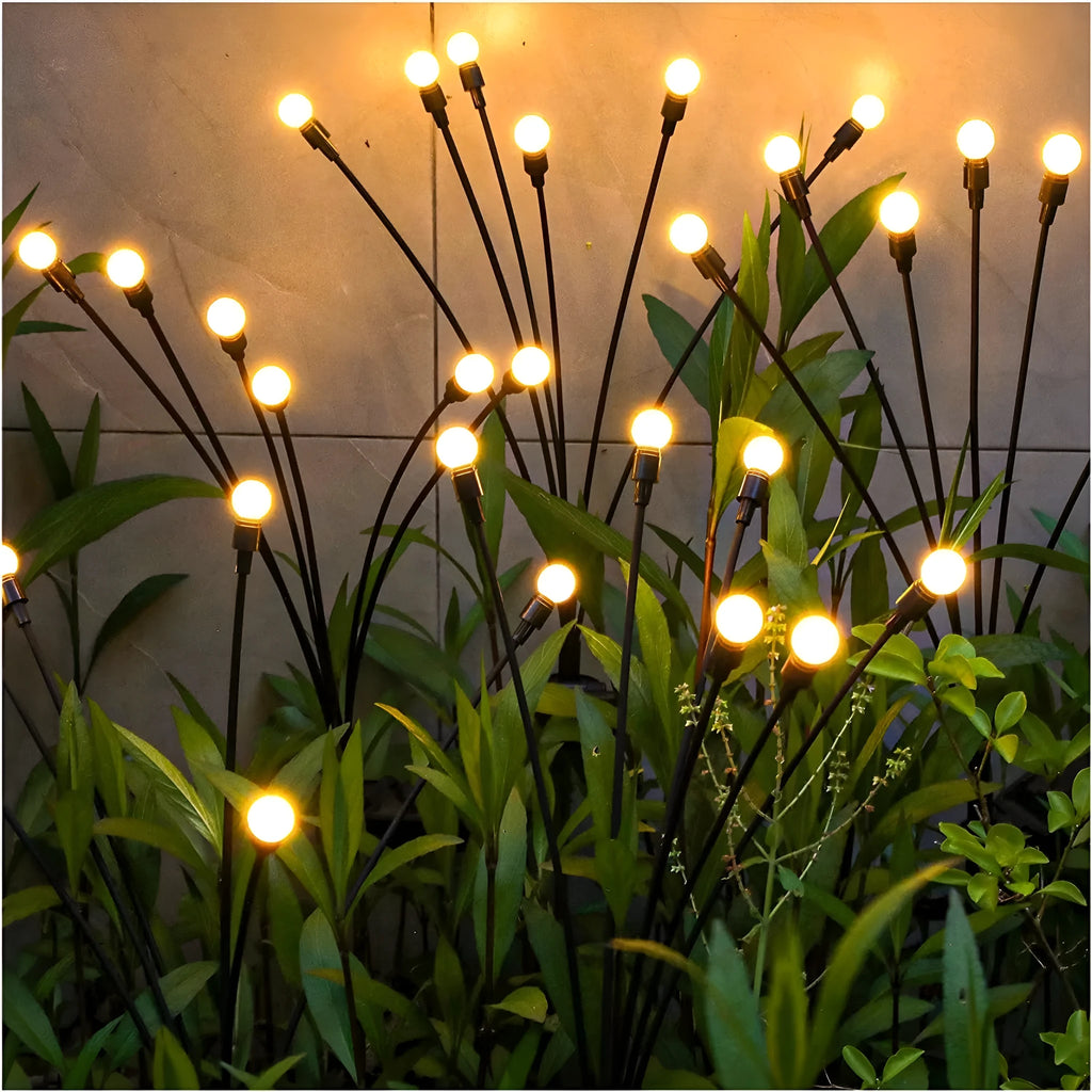 Solar-powered LED ground spike garden light with multiple head cluster options
