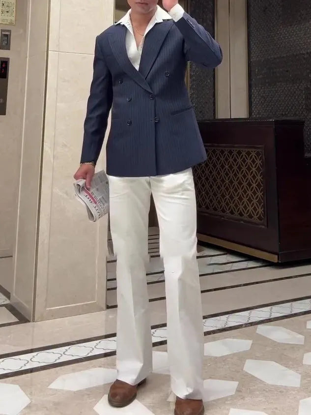 Man wearing a classic striped double-breasted polyester blazer jacket.